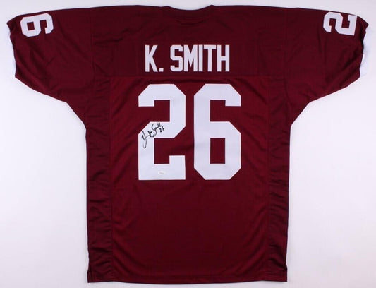 An Autographed Maroon Aggie Game Jersey with k smith's name on it, made by Hendolph.